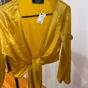 Yellow long sleeve crop top.